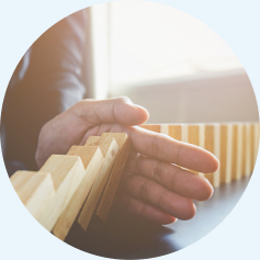Hands arranging blocks in partnership