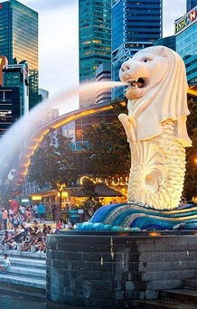 Merlion statue and skyline at night in Singapore